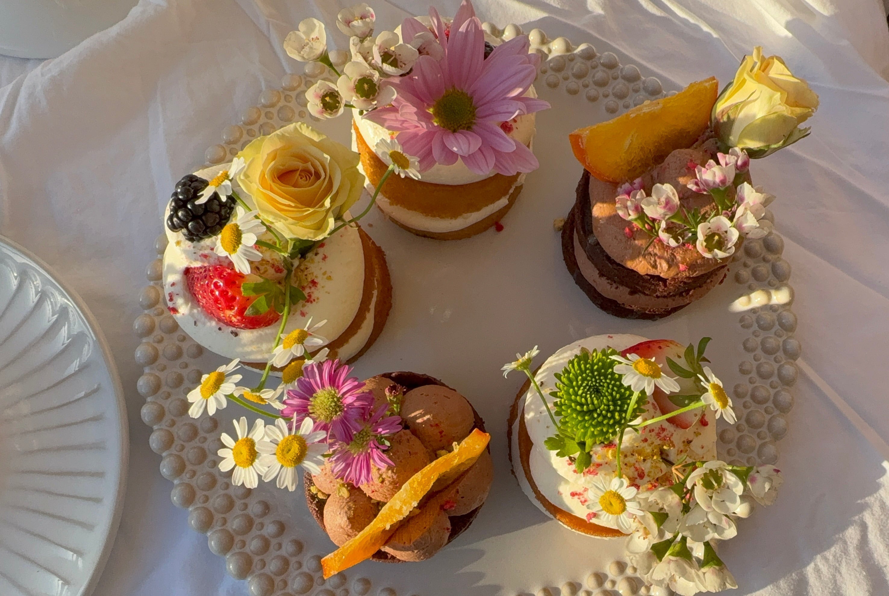 baby shower dessert bar with floral mini cakes