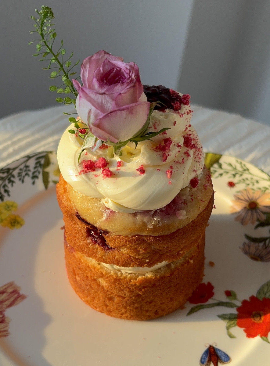 a mini cake with a rose on top