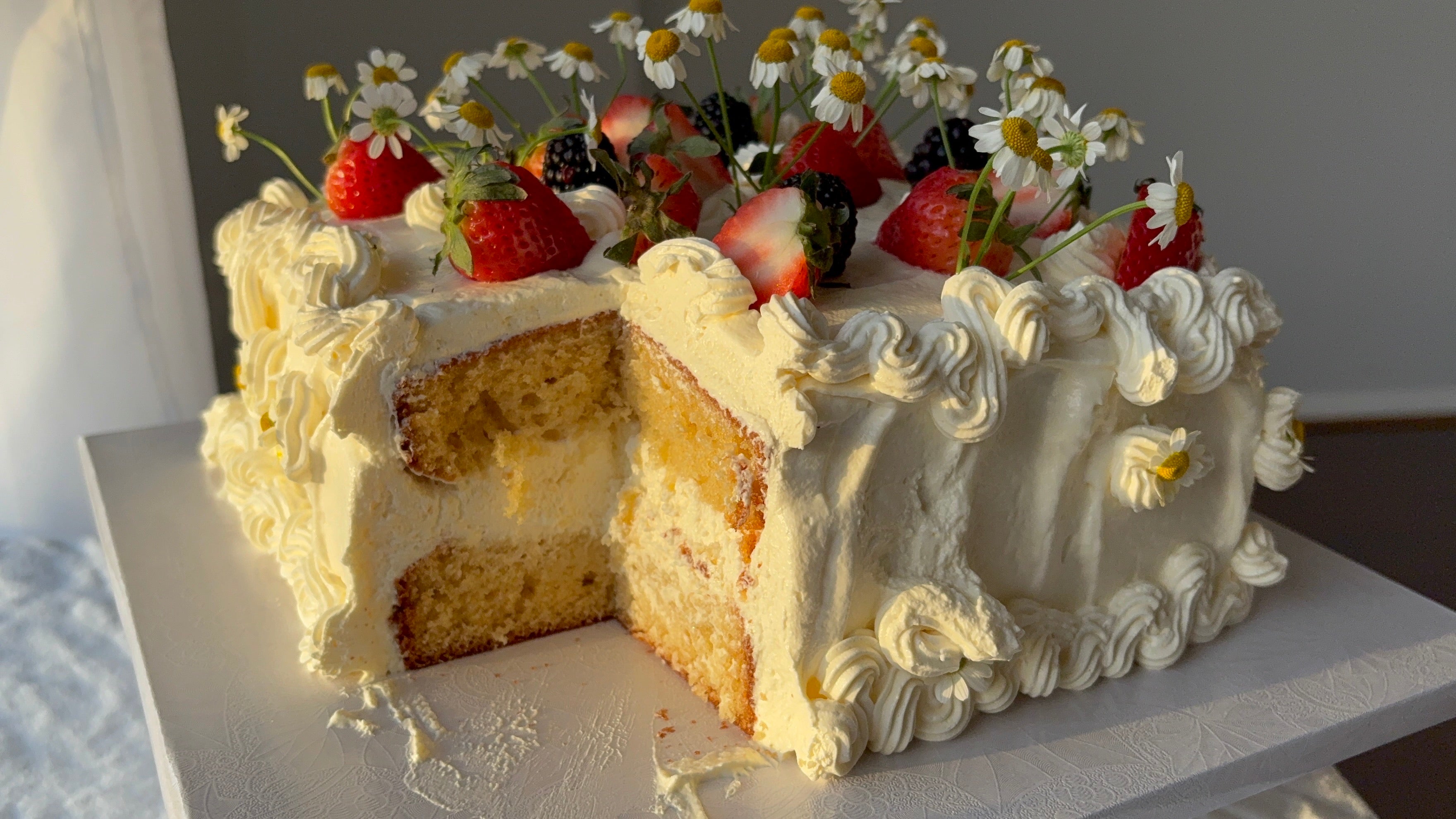 bakery vanilla cake with a slice missing