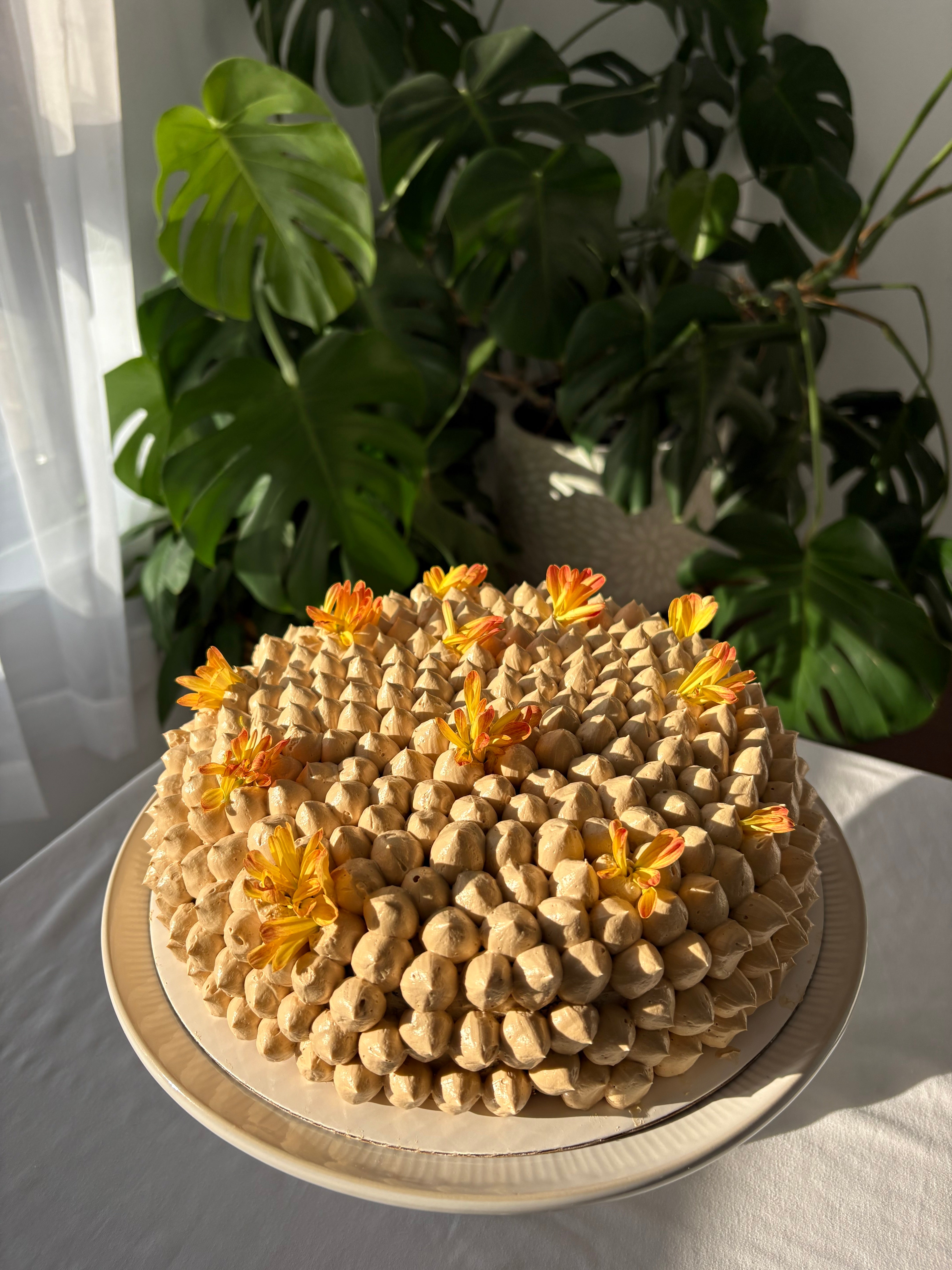 orange lemon cake garnished with flowers